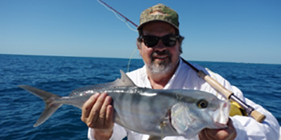 Sig holding a large fish he caught while fly fishing.  This was featured in a magazine.